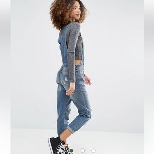 Abercombie & Fitch distressed denim overalls.